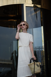 a lady wears a knitted top with a matching midi skirt